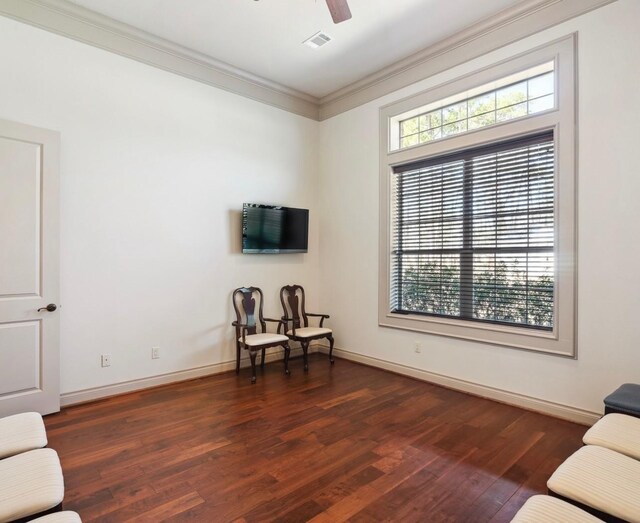 901 Longmire Rd Unit 17, Conroe, TX 77304 - living area with wood finished floors, ornamental molding, baseboards, and a ceiling fan