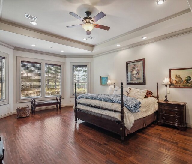 901 Longmire Rd Unit 17, Conroe, TX 77304 - bedroom with ornamental molding, wood-type flooring, a raised ceiling, recessed lighting, and baseboards