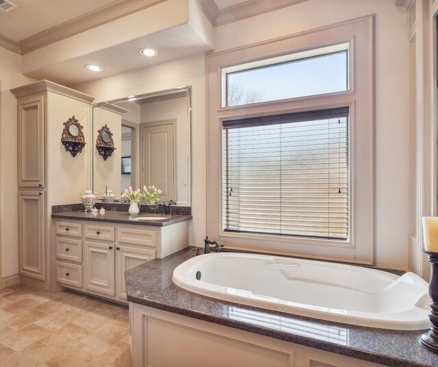 901 Longmire Rd Unit 17, Conroe, TX 77304 - full bath featuring vanity, a garden tub, ornamental molding, and recessed lighting