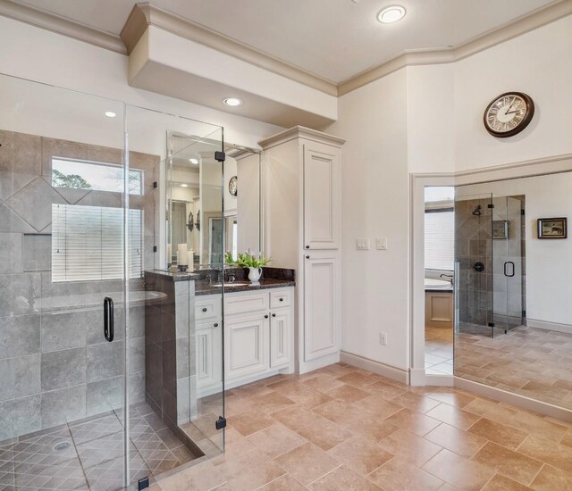 901 Longmire Rd Unit 17, Conroe, TX 77304 - bathroom with vanity, baseboards, a shower stall, ornamental molding, and recessed lighting
