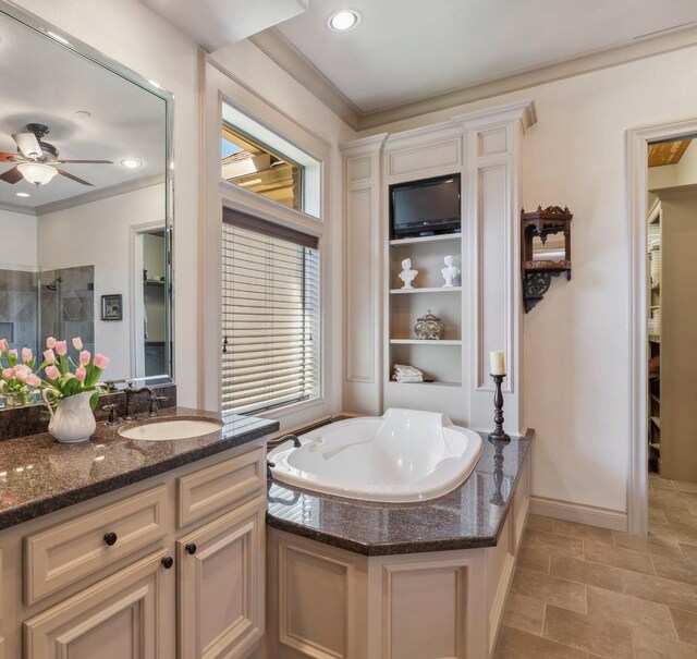 901 Longmire Rd Unit 17, Conroe, TX 77304 - bathroom featuring a garden tub, vanity, healthy amount of natural light, a ceiling fan, and crown molding