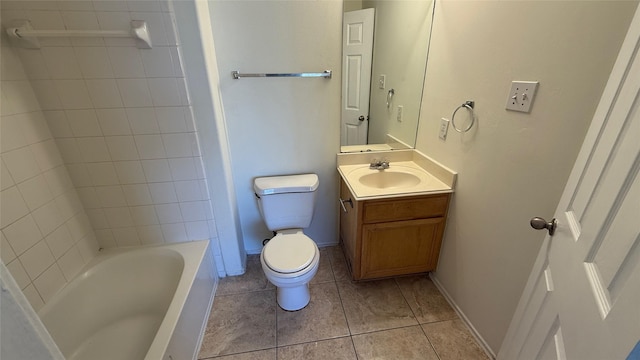 bathroom with baseboards, vanity, toilet, and tile patterned floors