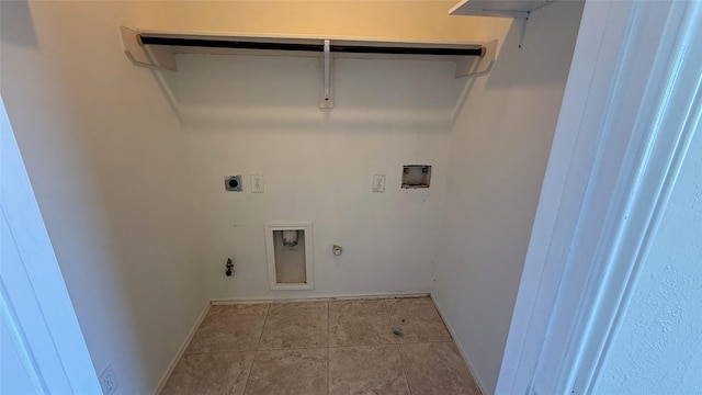 washroom with hookup for a washing machine, hookup for a gas dryer, electric dryer hookup, laundry area, and tile patterned floors