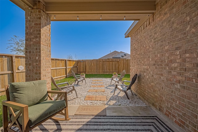 view of patio with a fenced backyard