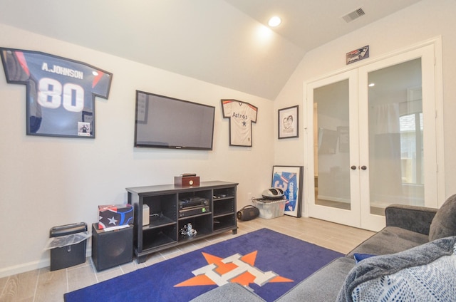 10711 Kingston Spring Dr, Missouri City, TX 77459 - tiled living area with french doors, vaulted ceiling, and recessed lighting