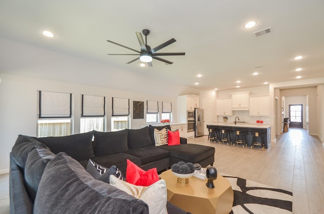 10711 Kingston Spring Dr, Missouri City, TX 77459 - living area featuring a ceiling fan, recessed lighting, light wood-type flooring, and baseboards