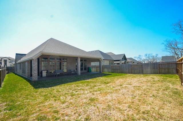 10711 Kingston Spring Dr, Missouri City, TX 77459 - rear view of property featuring brick siding and a patio