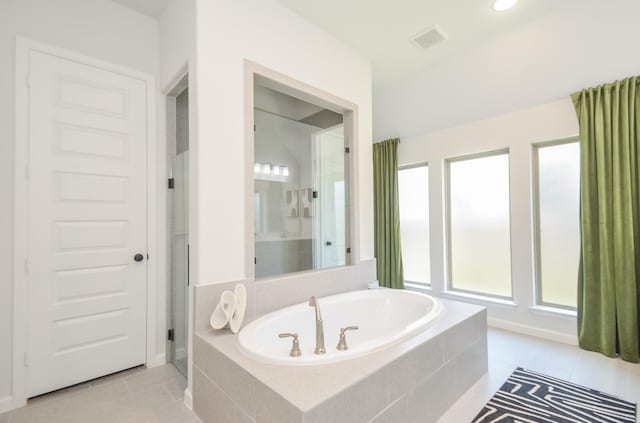 10711 Kingston Spring Dr, Missouri City, TX 77459 - bathroom with a bath, tile patterned floors, and an enclosed shower
