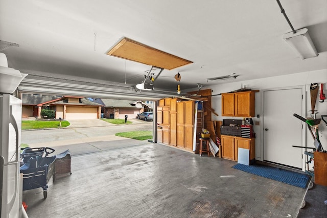 garage featuring a garage door opener