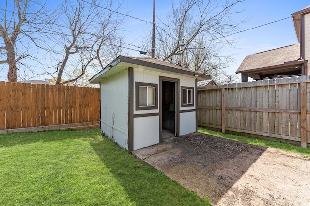 view of shed featuring a fenced backyard