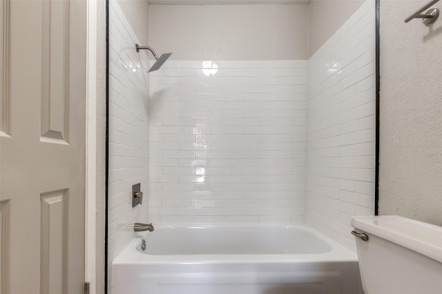 bathroom with toilet and shower / washtub combination