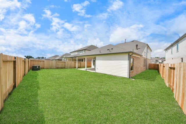 11926 Maple Oak Dr, Houston, TX 77066 - rear view of property with a fenced backyard, a patio, brick siding, and roof with shingles