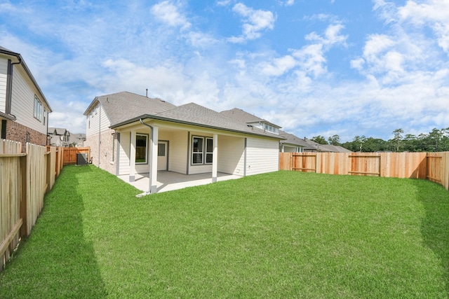 11926 Maple Oak Dr, Houston, TX 77066 - back of house with a shingled roof, a patio, and a fenced backyard