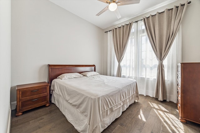 bedroom with dark wood-style floors and ceiling fan