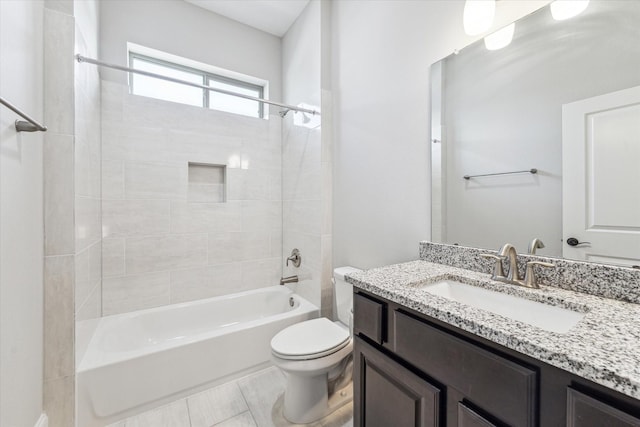 bathroom featuring shower / bath combination, vanity, and toilet