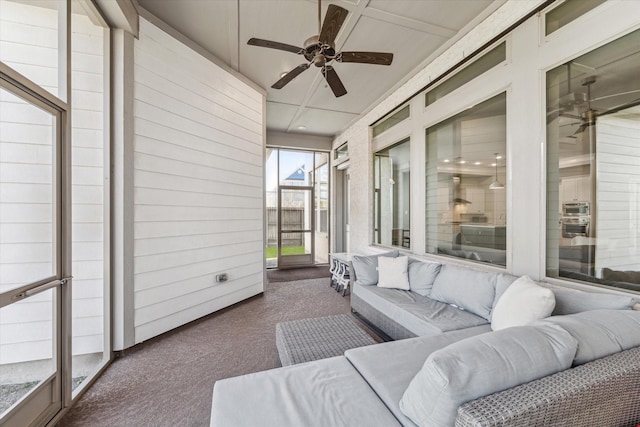 sunroom with a ceiling fan