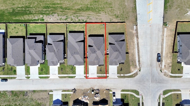 birds eye view of property with a residential view