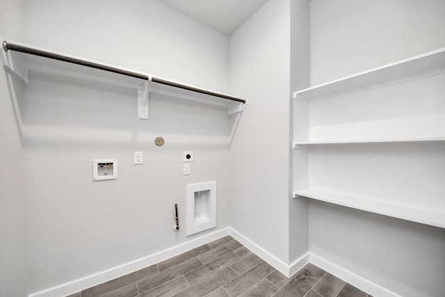 washroom with electric dryer hookup, wood finish floors, washer hookup, hookup for a gas dryer, and laundry area