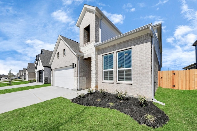 view of front facade featuring brick siding, driveway, and a front yard