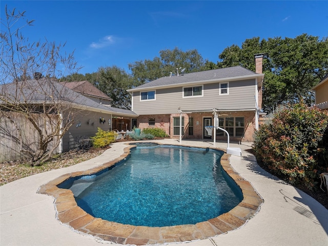 outdoor pool featuring a patio area