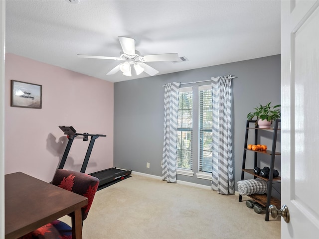 workout room featuring ceiling fan, carpet floors, visible vents, and baseboards