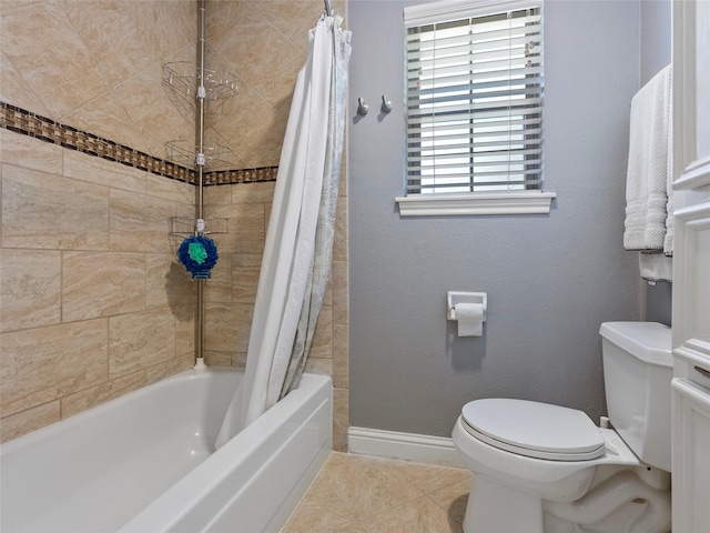 bathroom with shower / bath combo, toilet, baseboards, and tile patterned floors