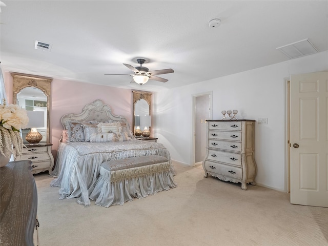 bedroom with a ceiling fan, light carpet, and baseboards