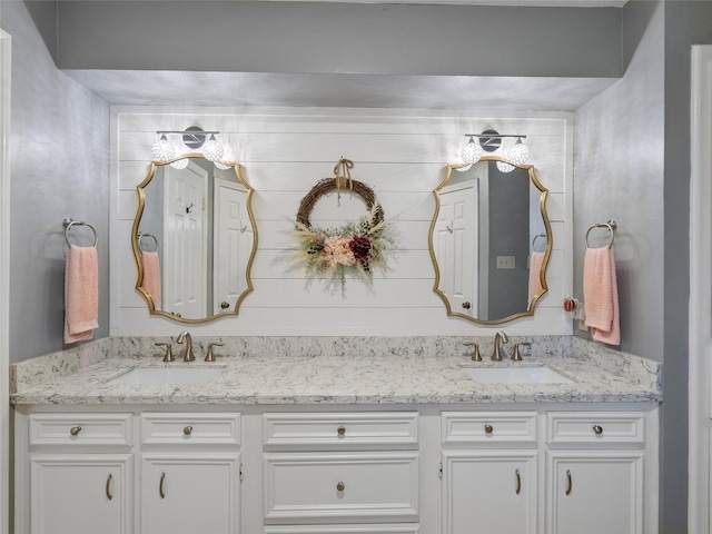 bathroom with double vanity and a sink