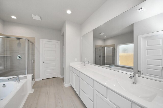 14811 Surfbird Ln, Houston, TX 77049 - bathroom featuring a sink, visible vents, a stall shower, and a bath