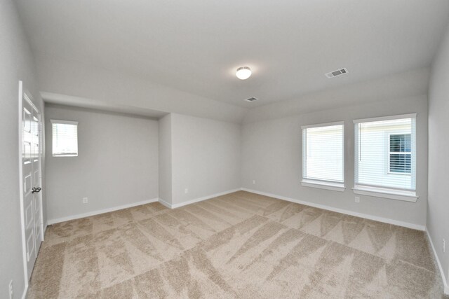 14811 Surfbird Ln, Houston, TX 77049 - carpeted empty room with visible vents, baseboards, and vaulted ceiling