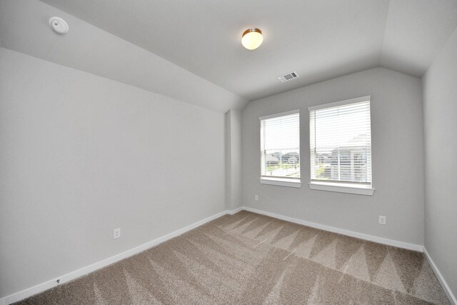 14811 Surfbird Ln, Houston, TX 77049 - carpeted spare room featuring visible vents, baseboards, and vaulted ceiling