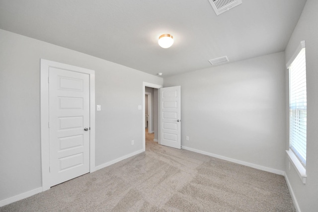 14811 Surfbird Ln, Houston, TX 77049 - unfurnished room featuring a wealth of natural light, visible vents, and carpet