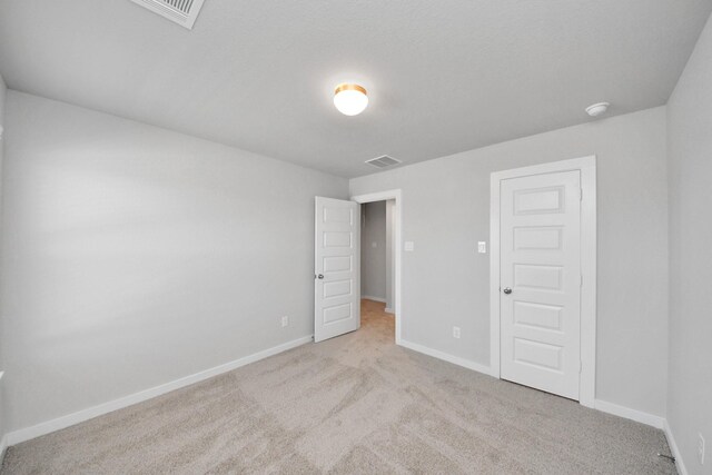 14811 Surfbird Ln, Houston, TX 77049 - carpeted spare room featuring baseboards and visible vents