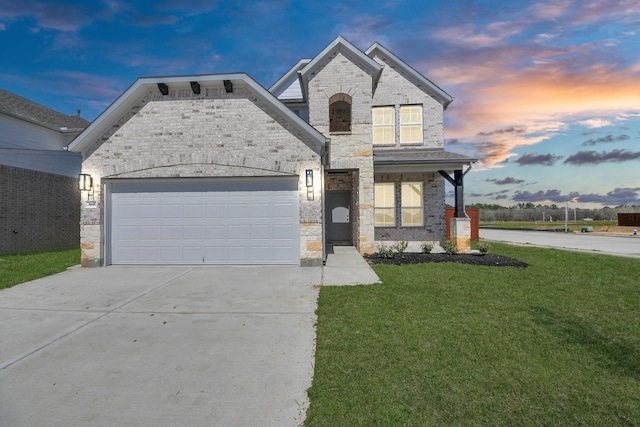 14811 Surfbird Ln, Houston, TX 77049 - french country inspired facade featuring brick siding, a lawn, driveway, and an attached garage