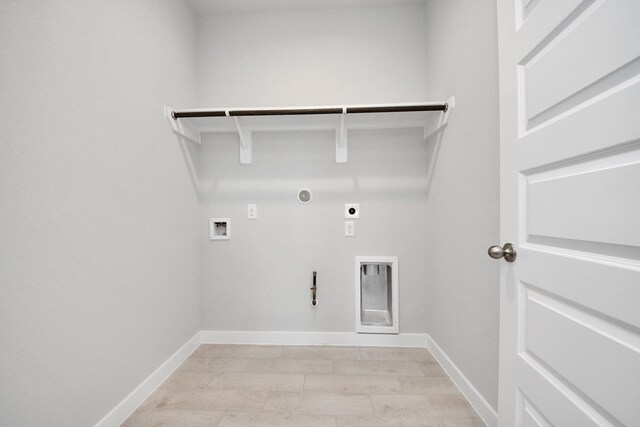 14811 Surfbird Ln, Houston, TX 77049 - laundry room with hookup for a washing machine, baseboards, gas dryer hookup, laundry area, and electric dryer hookup