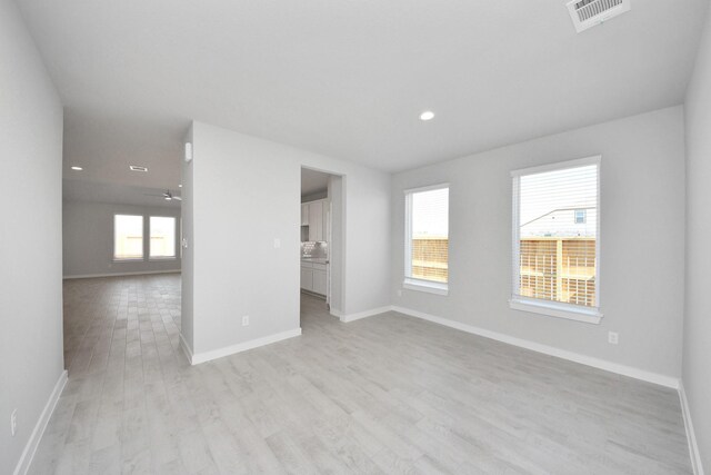 14811 Surfbird Ln, Houston, TX 77049 - empty room featuring recessed lighting, visible vents, baseboards, and light wood-style flooring