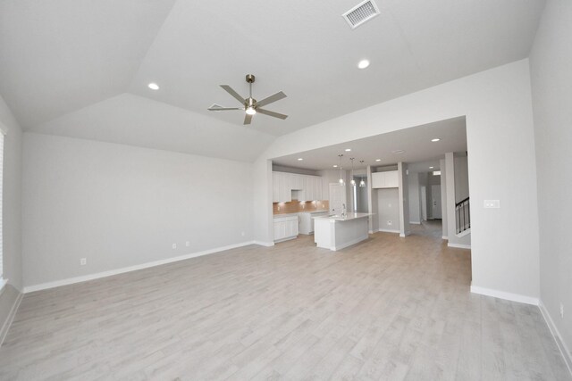 14811 Surfbird Ln, Houston, TX 77049 - unfurnished living room with a ceiling fan, recessed lighting, light wood finished floors, baseboards, and vaulted ceiling