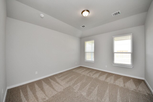 14811 Surfbird Ln, Houston, TX 77049 - unfurnished room with visible vents, baseboards, carpet, and vaulted ceiling