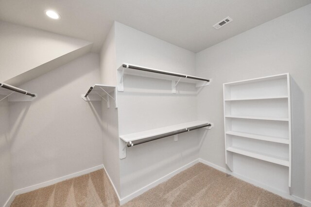 14811 Surfbird Ln, Houston, TX 77049 - walk in closet featuring carpet flooring and visible vents