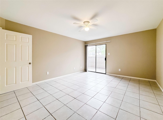 empty room featuring ceiling fan, baseboards, and light tile patterned floors