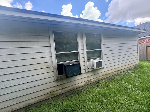 view of side of property with cooling unit