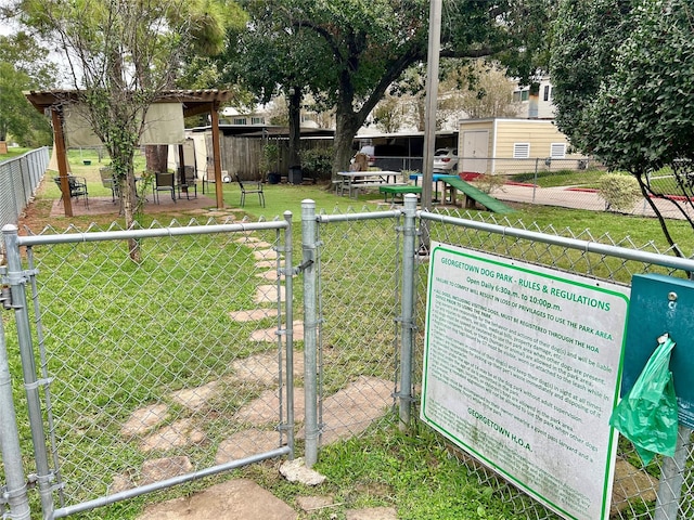 exterior details featuring fence and a gate