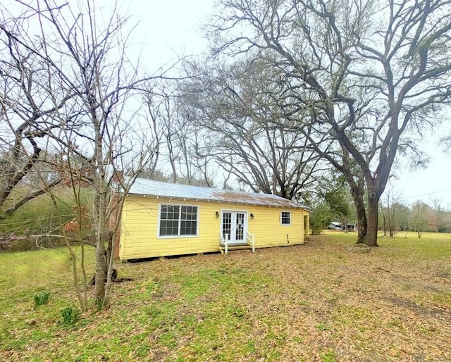 rear view of property with french doors