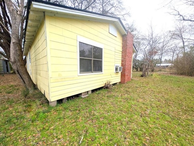 view of home's exterior with a yard and a chimney