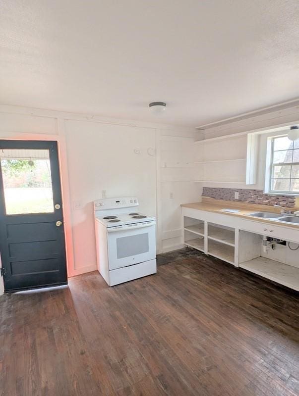 kitchen featuring white electric stove, a sink, backsplash, open shelves, and dark wood finished floors