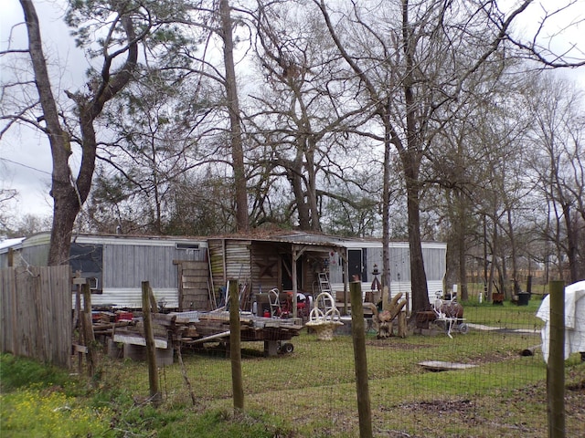 back of house with a lawn