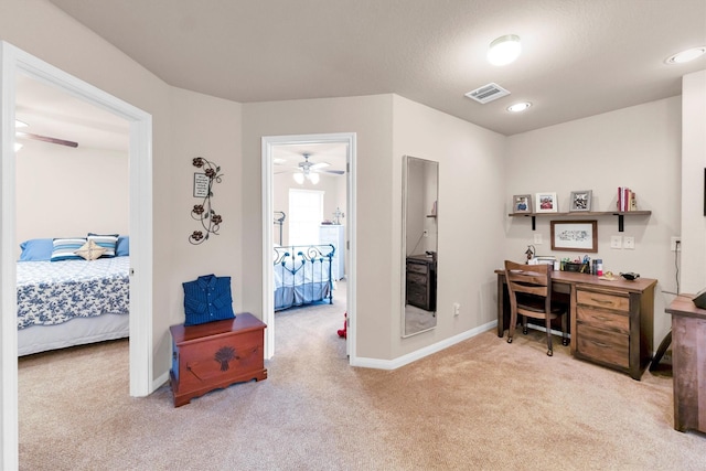 home office with visible vents, baseboards, ceiling fan, carpet flooring, and washer / dryer