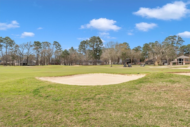 view of property's community featuring a yard