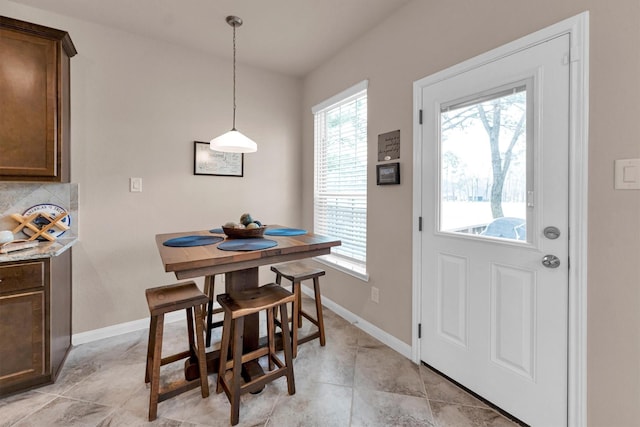 dining space with baseboards