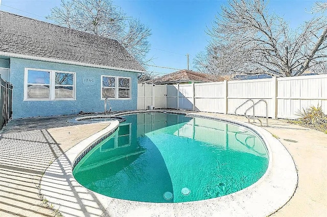 view of swimming pool featuring a patio area, a fenced backyard, and a fenced in pool